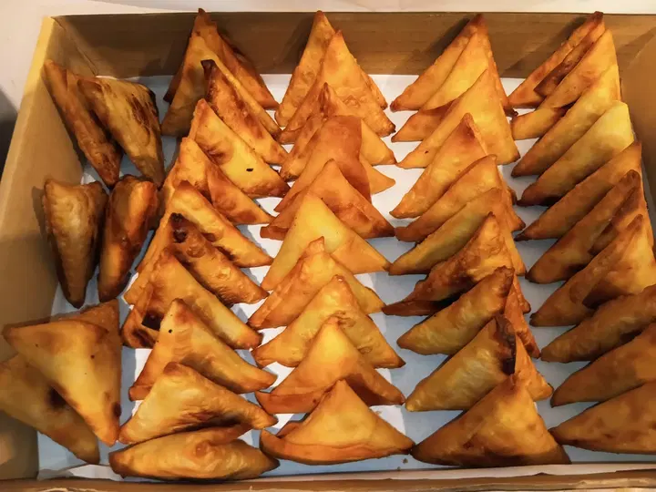 Box of golden fried samoosas